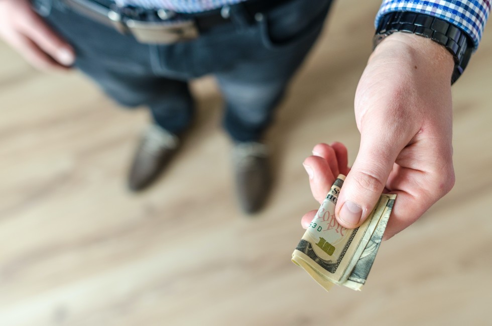 person-holding-banknote-928184